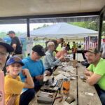 Jim, Bill, John and Denny working hard to tie those flies.